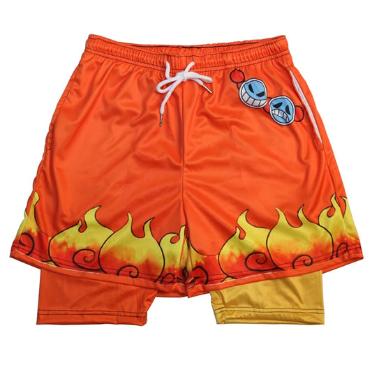 One Piece Ace-style shorts with an orange to yellow gradient and flame design. Patch with sunglasses on the left thigh. Elastic waistband with white drawstring.